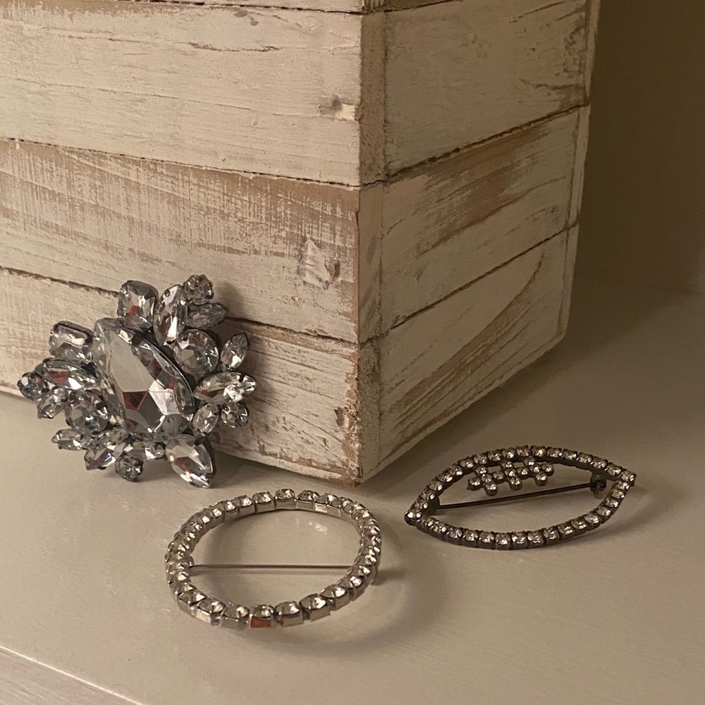 Brooches with Clear Rhinestones.  Football Pin, Oval Pin and a Fancy Cluster Pin